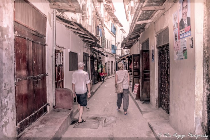 Farah and Jason walking down the streets of stone town