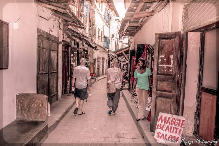 Farah and Jason walking down the streets of stone town